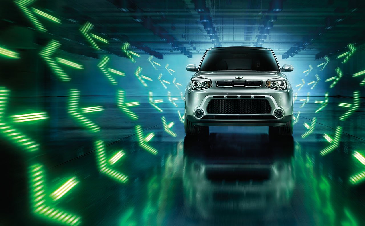 Kia Soul with green arrows pointing forward
