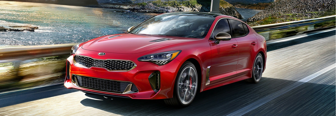 The 2018 Kia Stinger driving down a road