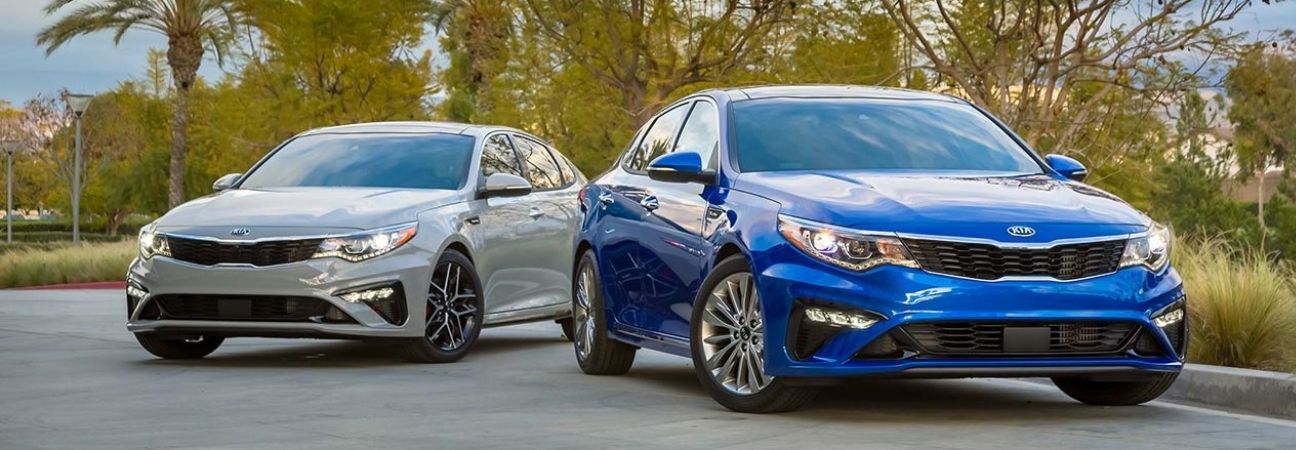 two 2019 Kia Optima's parked next to each other